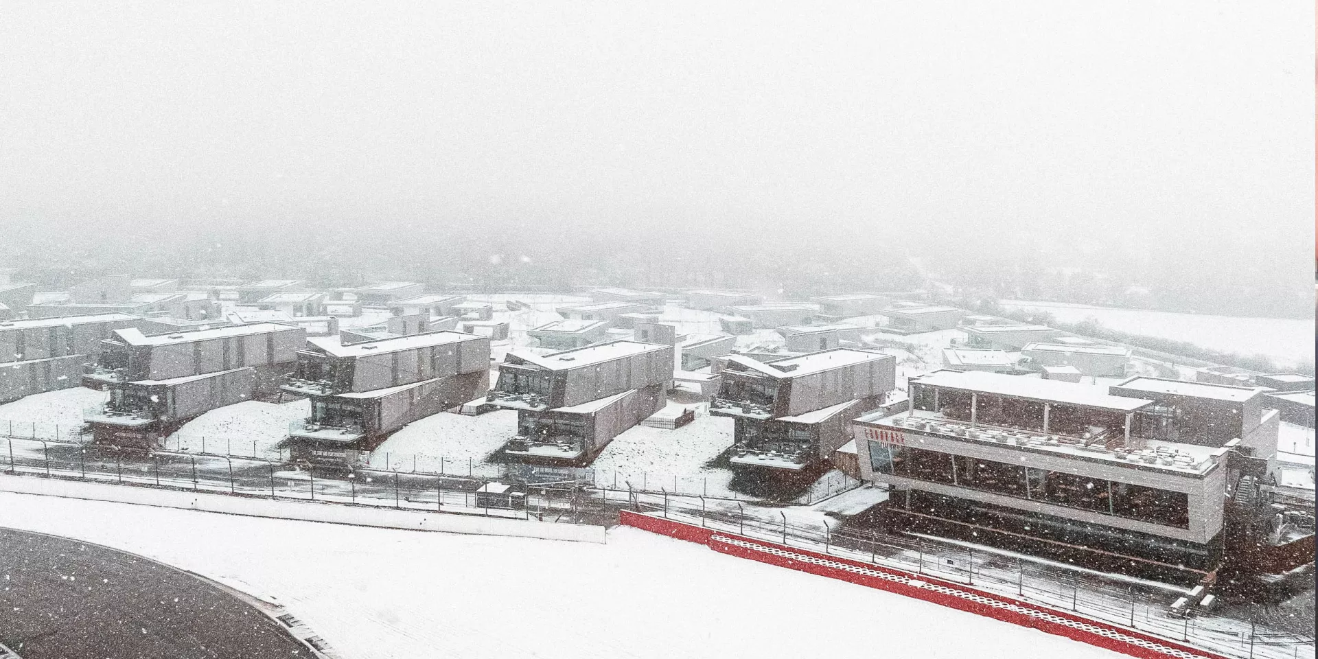 snow falling over the escapade estate